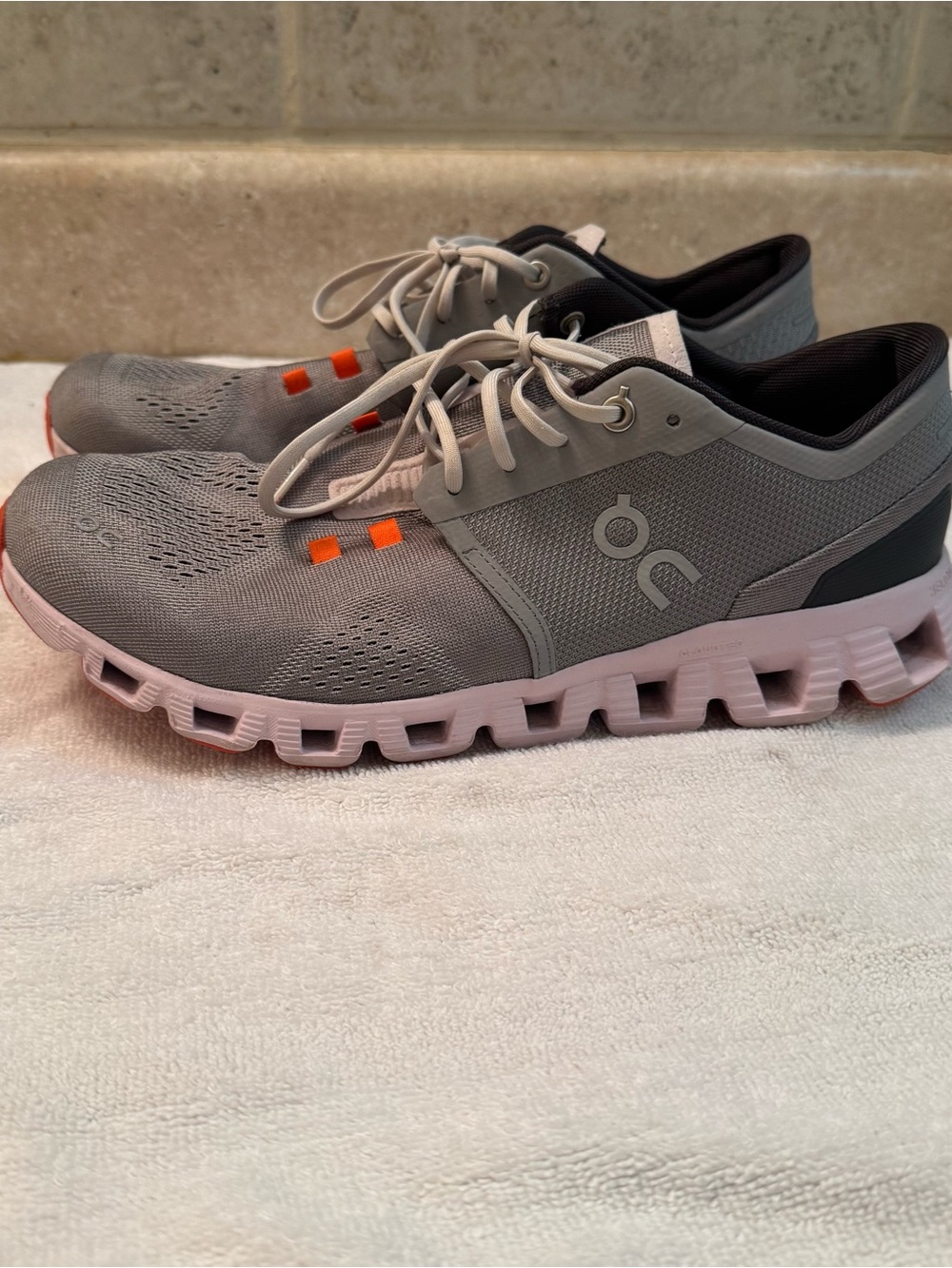On Running Grey Mesh Athletic Shoes with Pink Sole and Orange Accents
